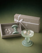 Luxury soap gift set featuring a transparent handmade hydrating soap with four genuine freshwater pearls, handcrafted glass soap dish and premium gift box.